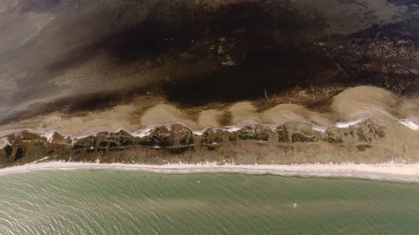 Aerial Shot of a Hilly Sandy Coastline at the Black Sea on a Sunny Day in Summer