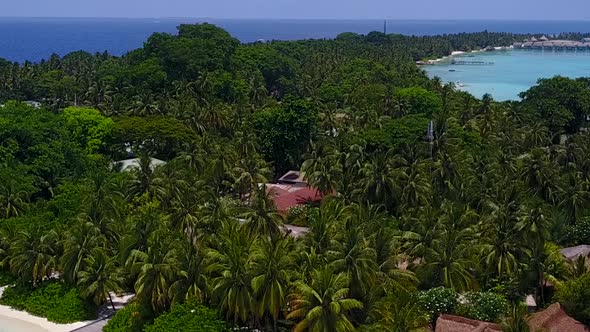 Aerial drone tourism of tropical seashore beach by blue sea with sand background