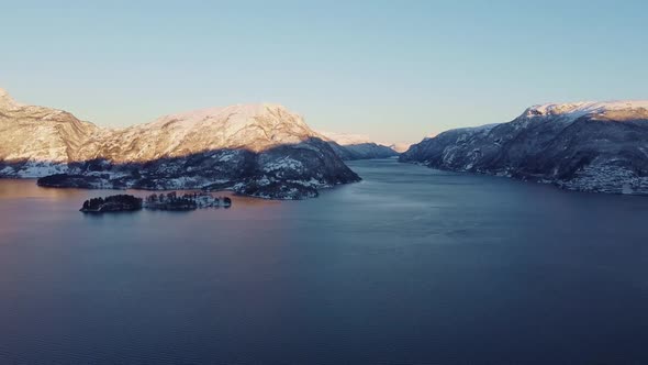 Aerial showing Osteroy Veafjorden and Vaksdal from Langhelle - Panning aerial in winter morning - No