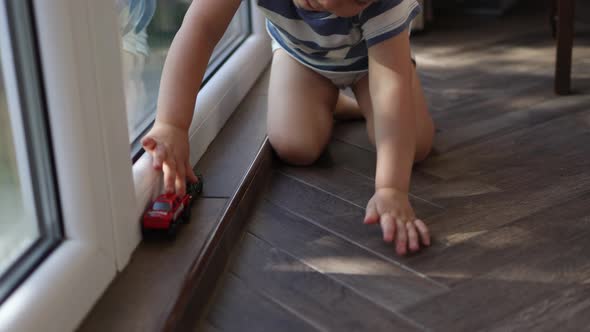 Little Caucasian Toddler Kid Child Playing Toy Cars Living Room Floor Window