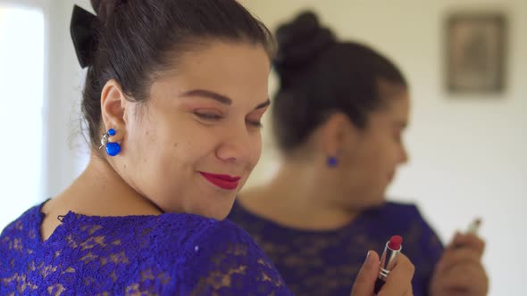 Fat Girl Paints Her Lips in Front of a Mirror