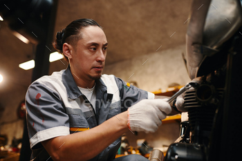 Repairman Fixing Vehicle