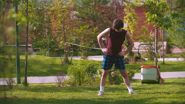 A Young Man Warming Up in the Park