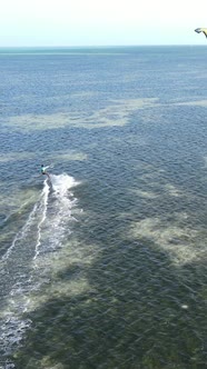 Vertical Video Kitesurfing Near the Shore of Zanzibar Tanzania