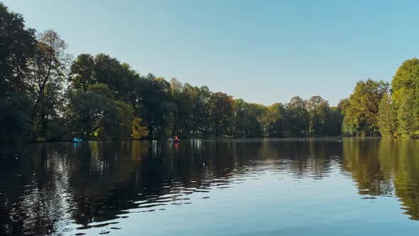 Floating By River in Autumn in City Park