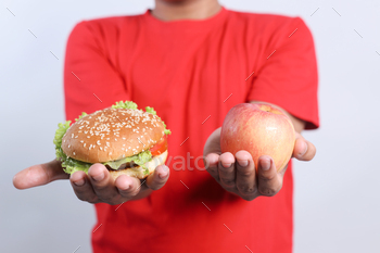 Burger or Apple. Healthy Food Versus Unhealthy Food