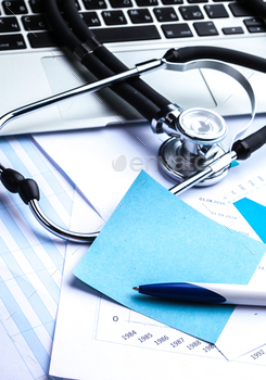 Medical stethoscope on computer keyboard