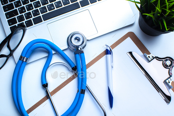 Medical stethoscope on computer keyboard