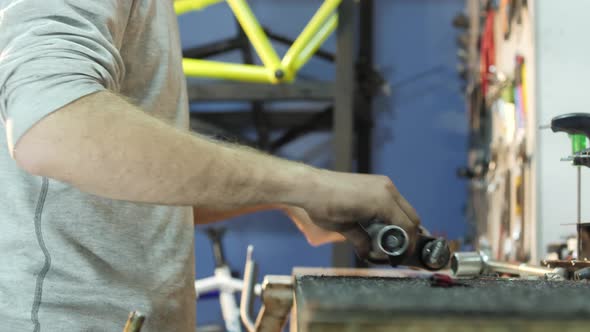 Mechanic repairing a bike fork