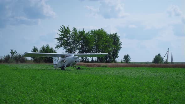 Airplane Stopping Green Airfield Going to Parking