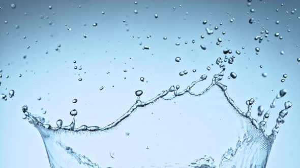 Super Slow Motion Shot of Water Splash at 1000Fps on Blue Gradient Background