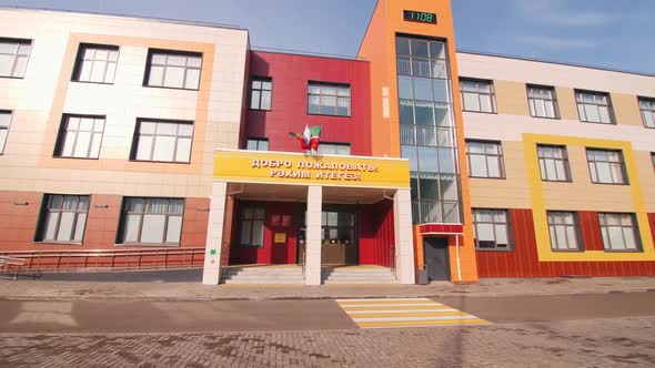 Text Welcome on Entrance to School with Waving Flags