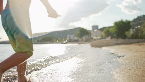 Slow Motion Video of a Happy Child Boy Running on the Beach