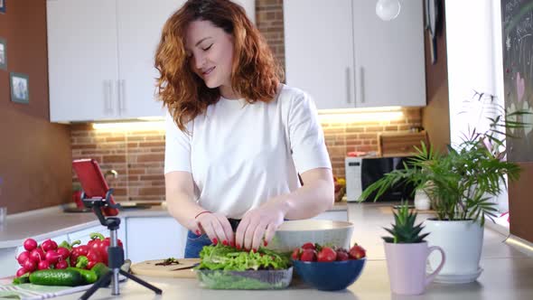 Young Woman at Home in Kitchen Tells Recipe on Camera