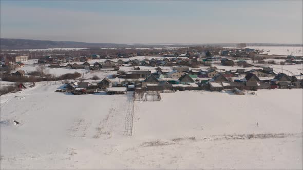 Russian Village in Winter Shot From a Quadrocopter. Aerial View of the Typical Russian Village