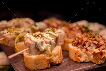 a tray of food with a sandwich and meat on it.