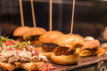 a tray of food with a sandwich and meat on it.