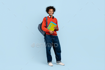 Young man with books and backpack