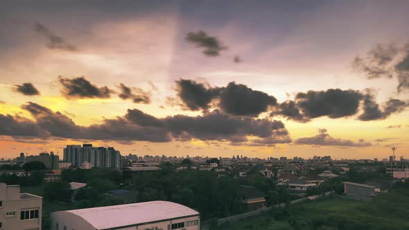 Golden hour Cloud shadows at summer day with Urban forest and Bangkok city downtown.