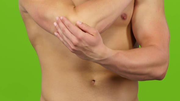 Closeup. Man Suffers From Pain in Right Elbow, Green Screen