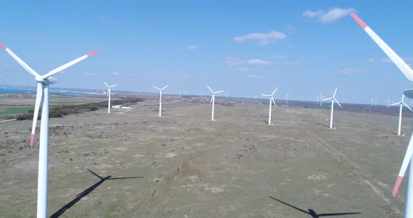 4K aerial view of windmills farm. Modern wind turbines.