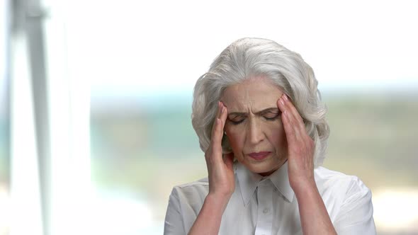 Mature Woman Suffering From Headache.