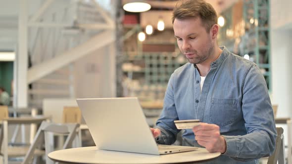 Unsuccessful Online Payment on Laptop By Casual Man