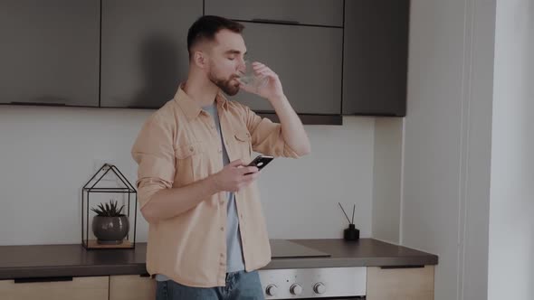 Handsome Man Drinking a Fresh Glass of Water