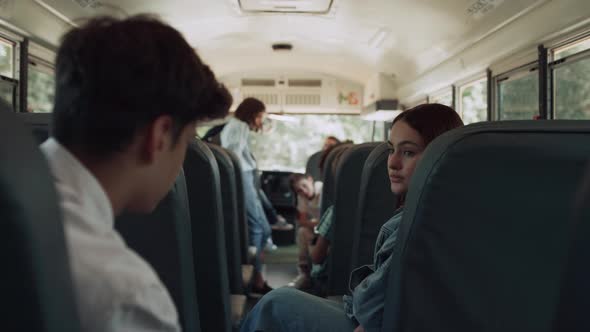Multiethnic Classmates Chatting Ride School Bus