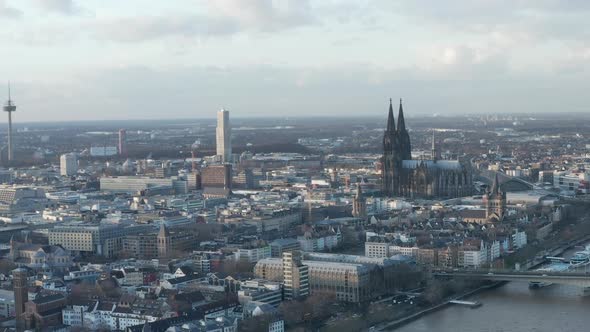 AERIAL: Wide Shot of Cologne Germany and Rhine River From the Air with Majestic Cathedral on Sunny