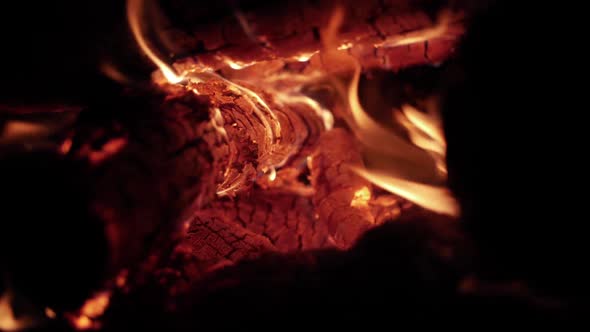 Wood Burning A Pile Of Wood Into Glowing Coals