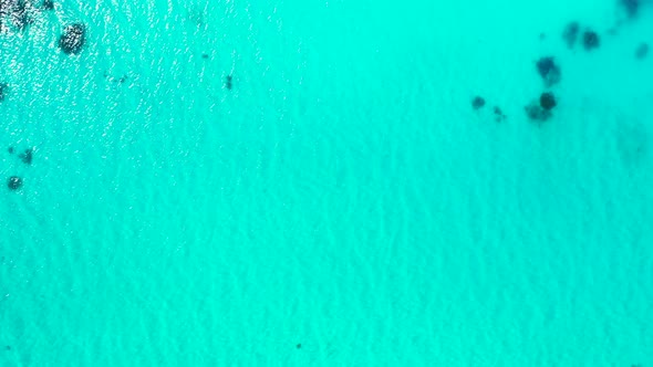 Luxury fly over abstract shot of a white paradise beach and aqua turquoise water background in high 