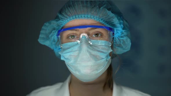 Scientist in Protective Uniform Looking to Camera, Tired Doctor After Surgery