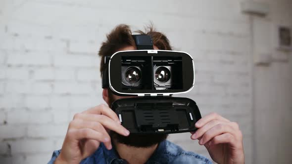 Man Wearing Virtual Reality Goggles in the Office