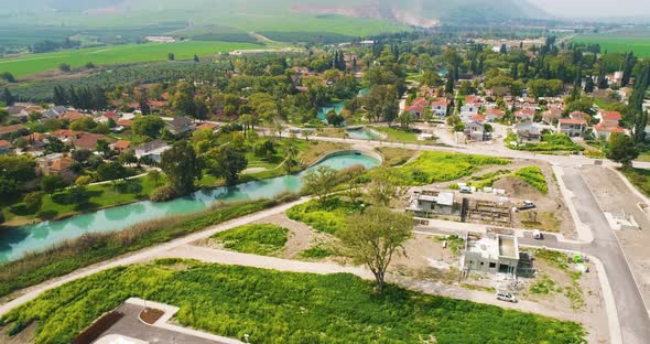 Aerial view of the town with hills in the background and Kibbutzim Stream.