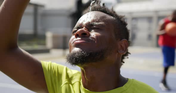 Basketball player pouring water on face 4k