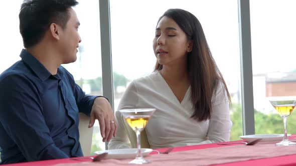 Happy Romantic Couple Eating Lunch at Restaurant