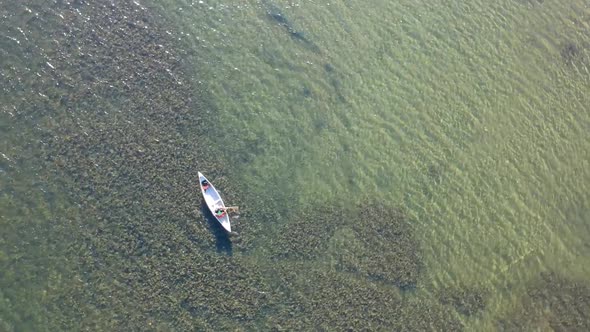 Drone shot of canoeing on a lake in BC Canada