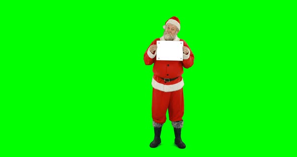 Santa claus holding blank board