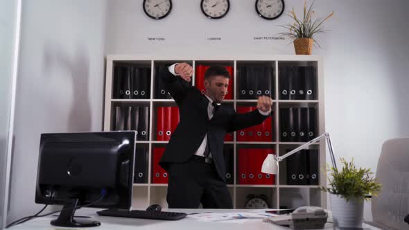 Businessman Dancing in Office