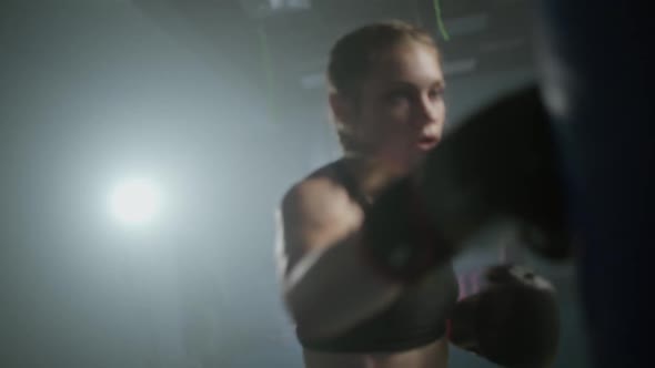 Female Fighter Trains His Punches Beats a Punching Bag Training Day in the Boxing Gym the Female