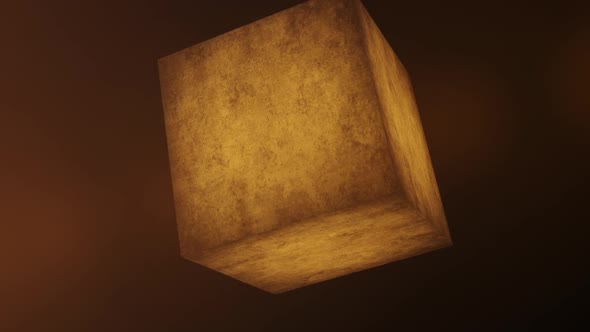 Orange cube of stone rotating in 3d frames.