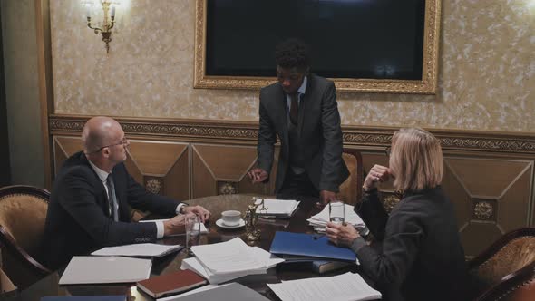 African American Lawyer Holding Business Meeting with Colleagues