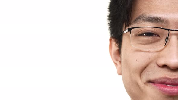 Half Side Portrait Closeup of Joyful Chinese Man 20s Wearing Eyeglasses Smiling with Perfect Teeth