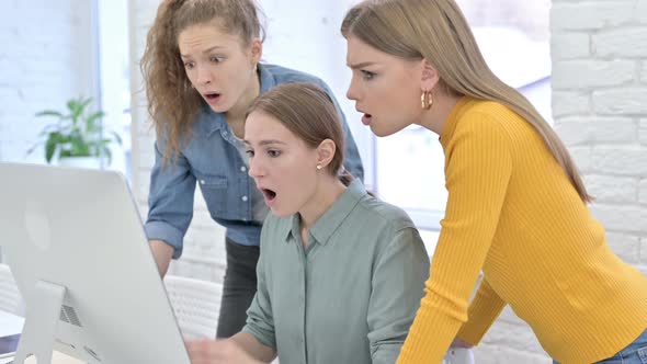 Disappointed Young Female Designers Reacting To Failure on Desktop