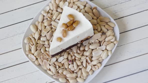 a Piece of White Cheesecake with Toffee and Nuts