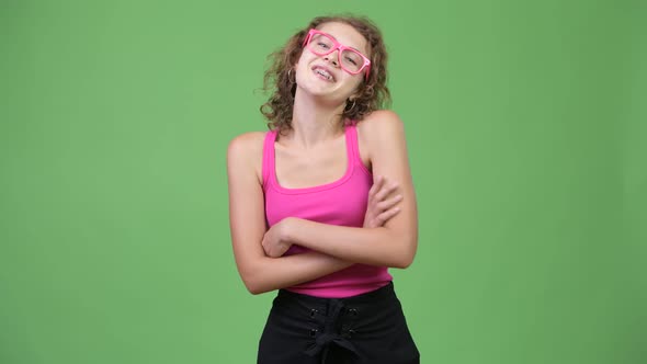 Young Happy Beautiful Nerd Woman Smiling with Arms Crossed