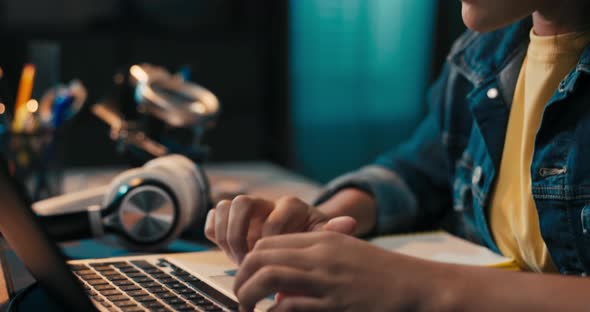 Happy Teenage Girl Sits at Desk in Room Using Laptop Learns How to Use Computer Programs