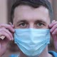 Man Takes Off His Medical Mask of Coronavirus Protection Outside and Smile - VideoHive Item for Sale
