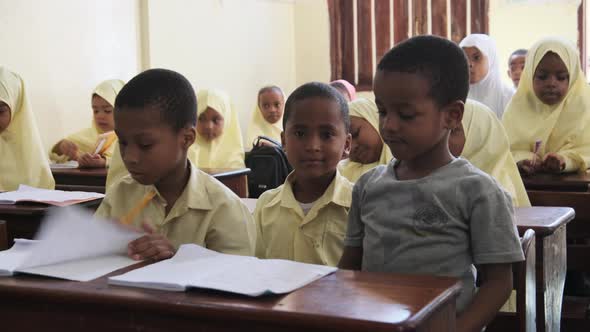 Children in an African Elementary School Sit at Desks in a Classroom Zanzibar